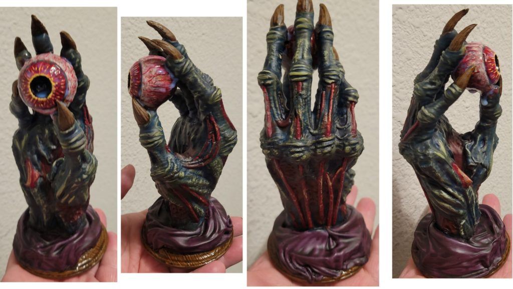 An ArchLich standing hand props holding the sanguine eye.